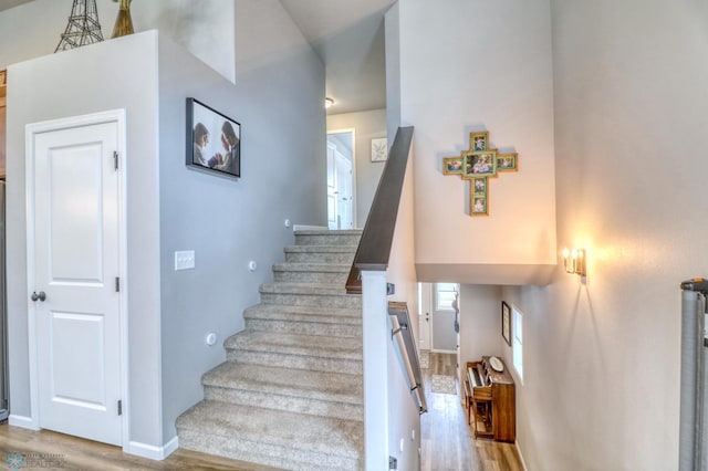 stairs featuring wood-type flooring