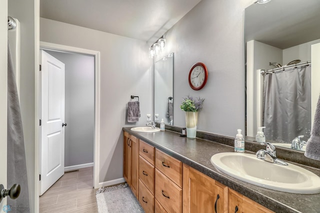 bathroom featuring vanity, a shower with shower curtain, and hardwood / wood-style flooring