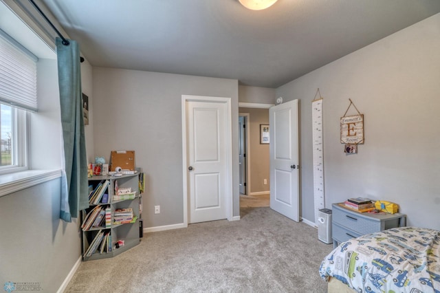 bedroom with light colored carpet