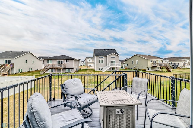 deck featuring a lawn and a playground