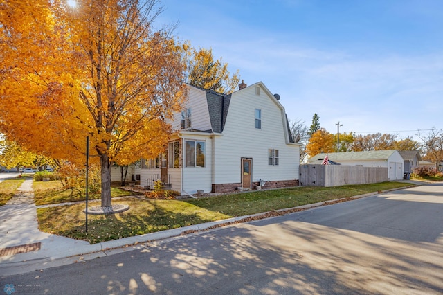 view of home's exterior with a yard