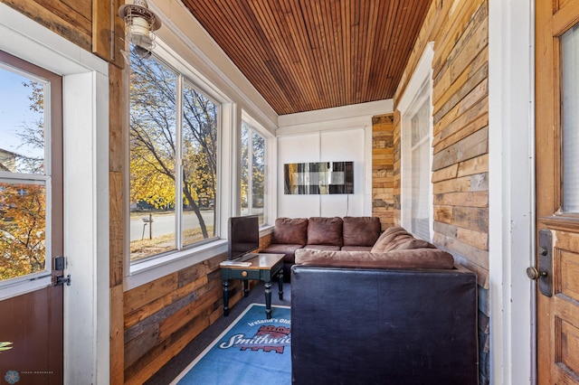 sunroom / solarium featuring wood ceiling