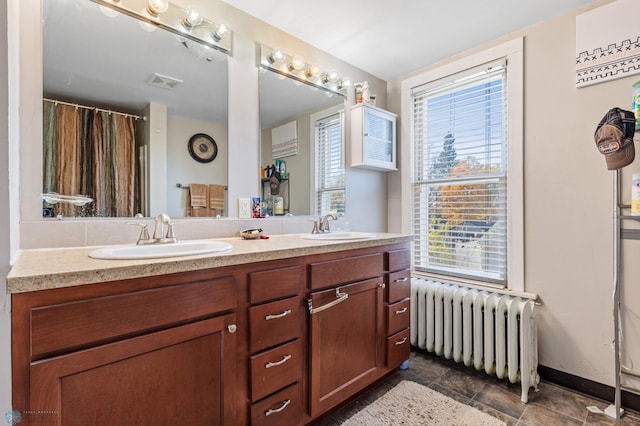 bathroom featuring vanity and radiator heating unit