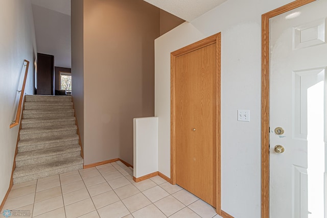 stairs with tile patterned flooring