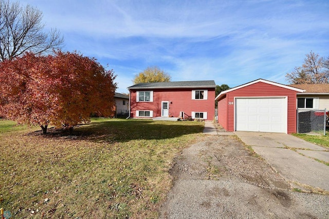 view of front of property with a front lawn and a garage