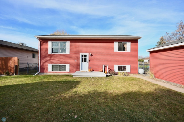 back of house with a yard and a patio area