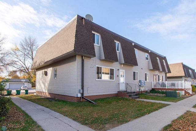 view of home's exterior with a garage and a lawn