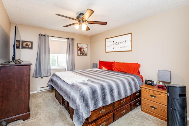 carpeted bedroom with a baseboard heating unit, a textured ceiling, and ceiling fan