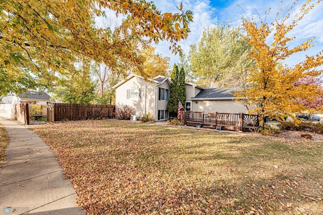 view of yard featuring a wooden deck