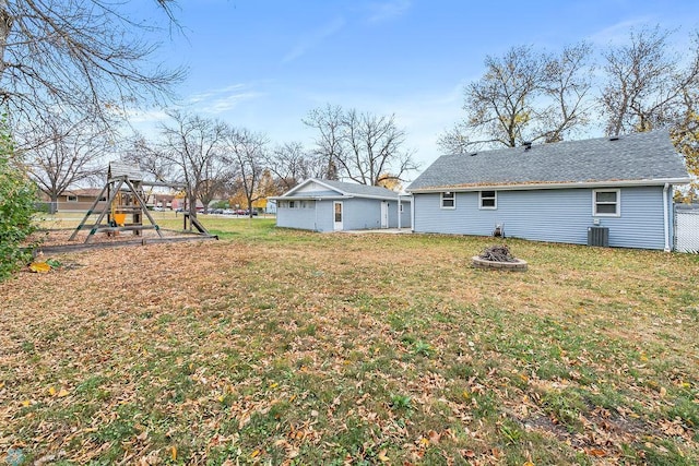 view of yard featuring a playground and central AC unit