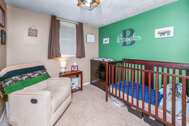 carpeted bedroom featuring a textured ceiling