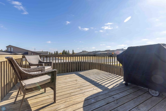 wooden deck featuring grilling area