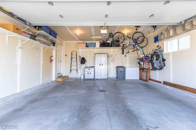 garage featuring a garage door opener