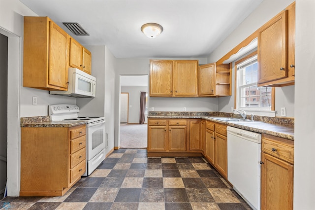 kitchen featuring sink and white appliances