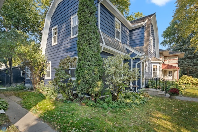 view of home's exterior with a lawn