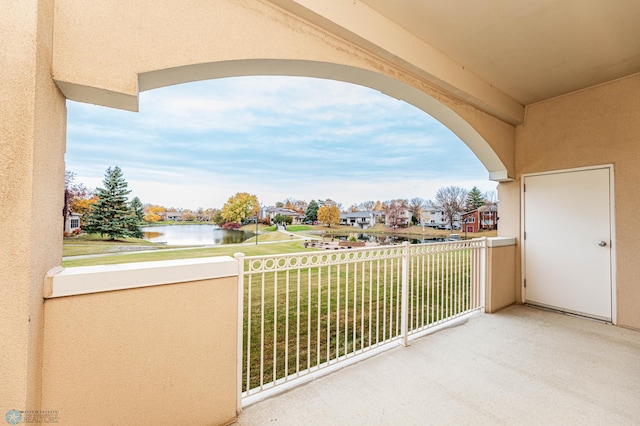 balcony featuring a water view