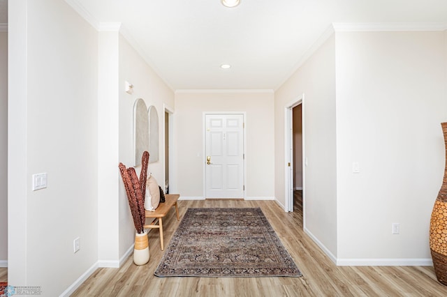 hall with crown molding and light wood-type flooring