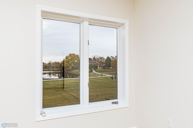 doorway to outside with a water view