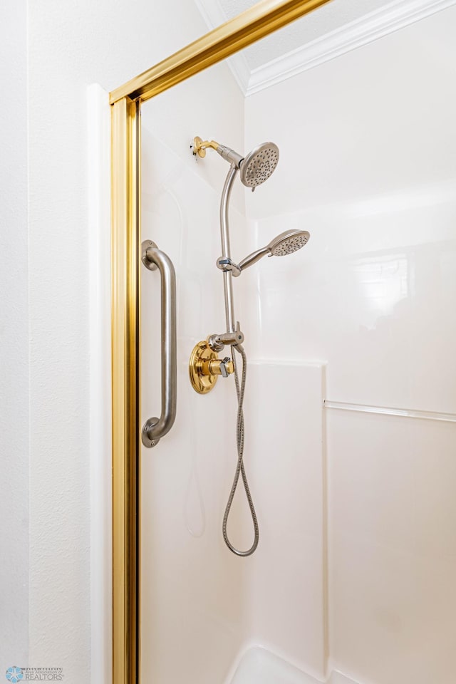 details featuring crown molding and walk in shower