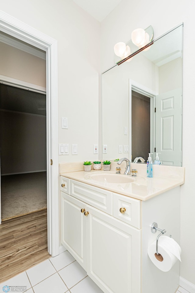 bathroom with vanity and wood-type flooring