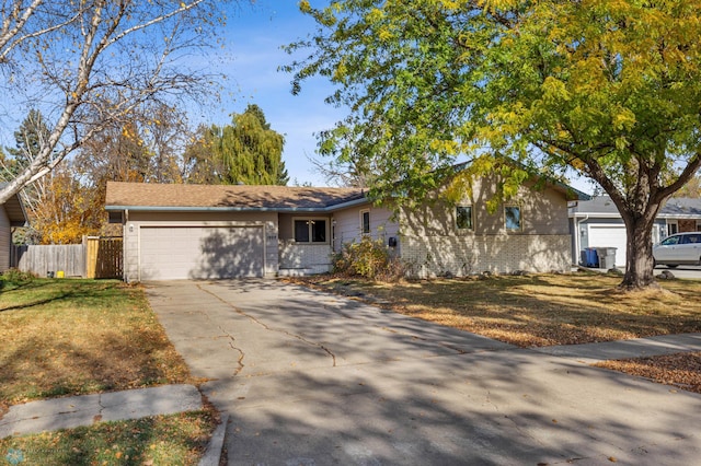 ranch-style house with a front lawn and a garage