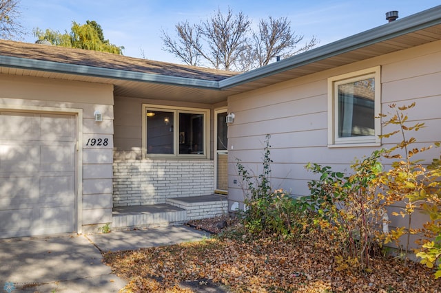 entrance to property featuring a garage