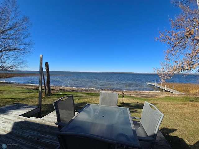 wooden deck featuring a water view