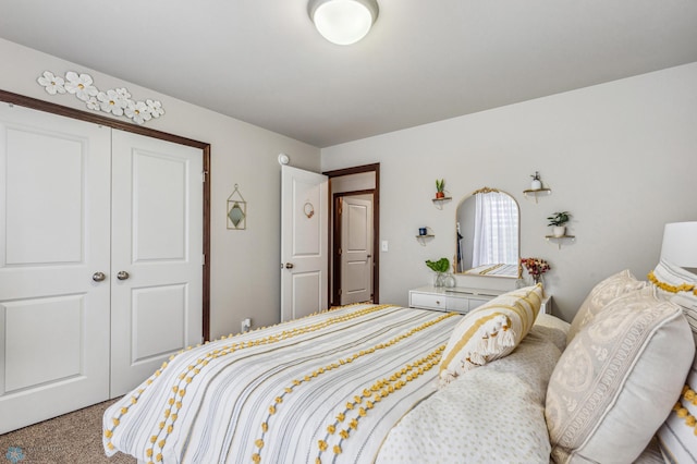 carpeted bedroom featuring a closet