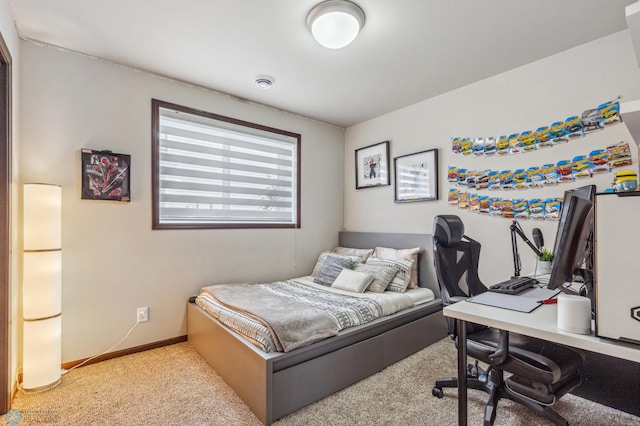 bedroom featuring light carpet