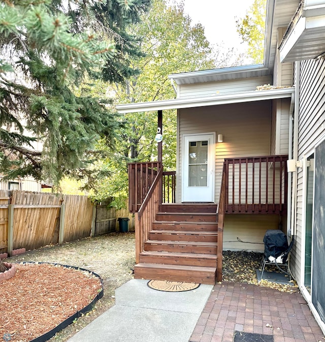 property entrance featuring a patio area