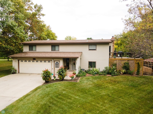 view of front of house featuring a front yard and a garage