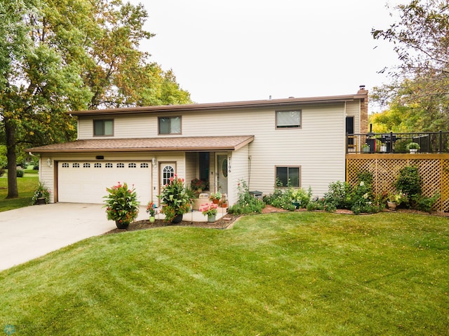 view of front of property with a front lawn and a garage