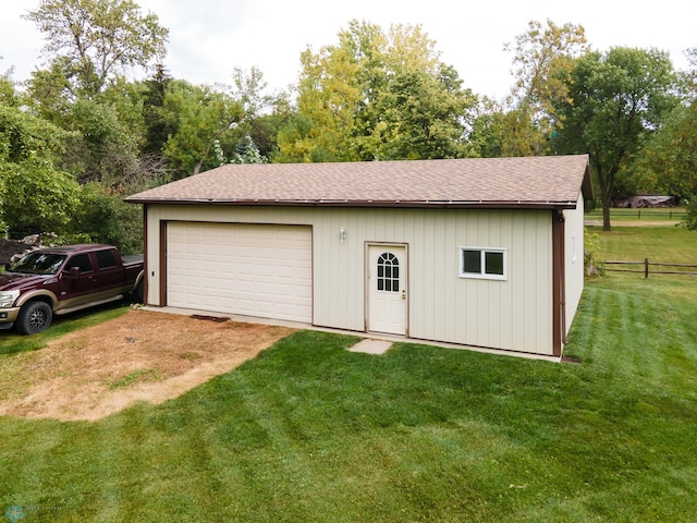 garage with a yard