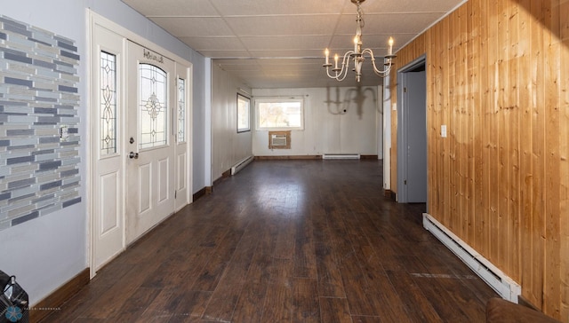 entryway featuring a baseboard heating unit, wooden walls, and dark hardwood / wood-style flooring