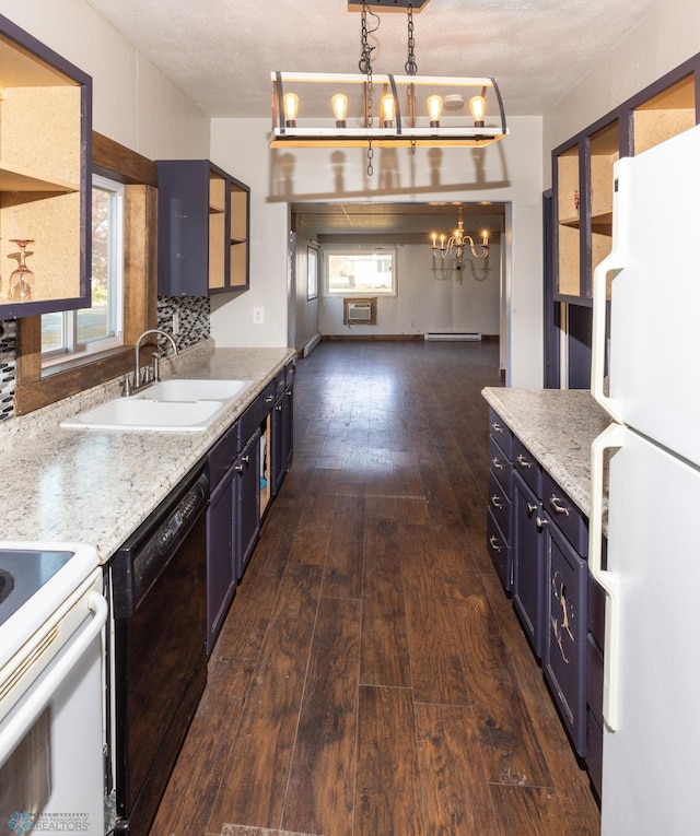 kitchen with black dishwasher, sink, white fridge, and a healthy amount of sunlight