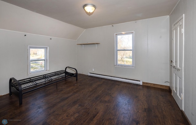 bonus room featuring lofted ceiling, a baseboard heating unit, and dark hardwood / wood-style flooring