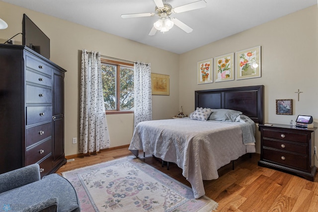 bedroom featuring light hardwood / wood-style floors and ceiling fan