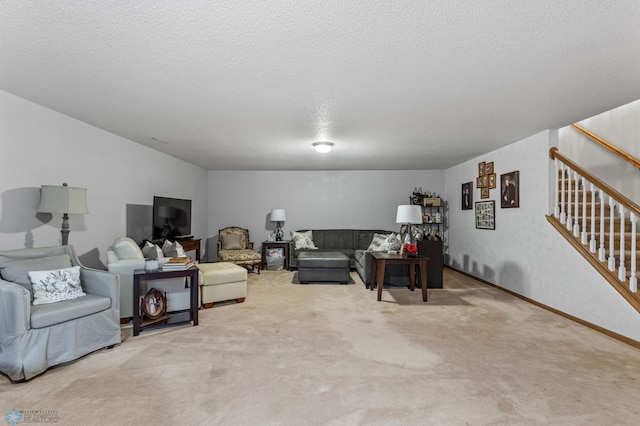 carpeted living room with a textured ceiling