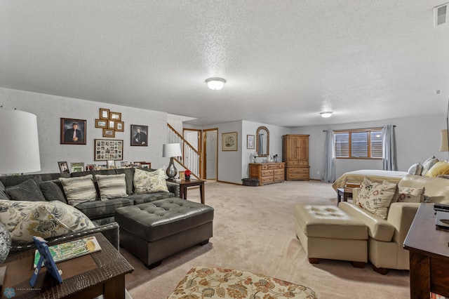 carpeted living room with a textured ceiling