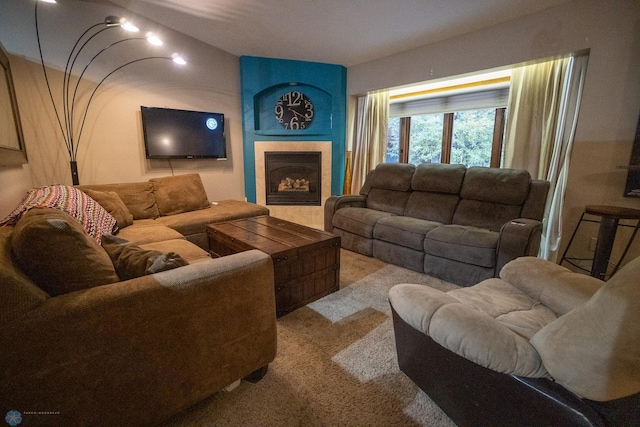 carpeted living room with a tiled fireplace