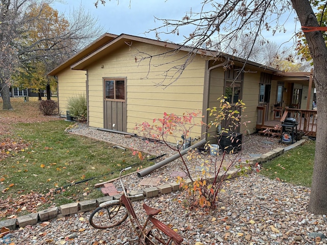 view of home's exterior featuring a yard