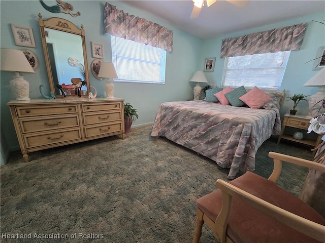 bedroom featuring ceiling fan and dark colored carpet