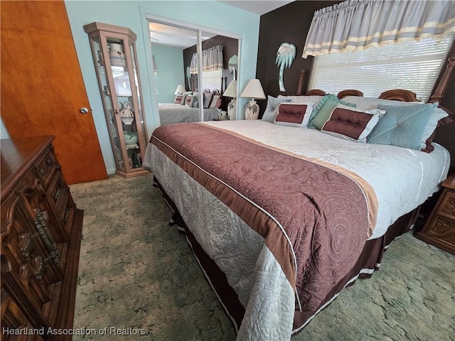 carpeted bedroom with a closet