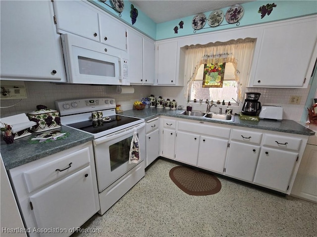 kitchen featuring tasteful backsplash, sink, white cabinets, and white appliances