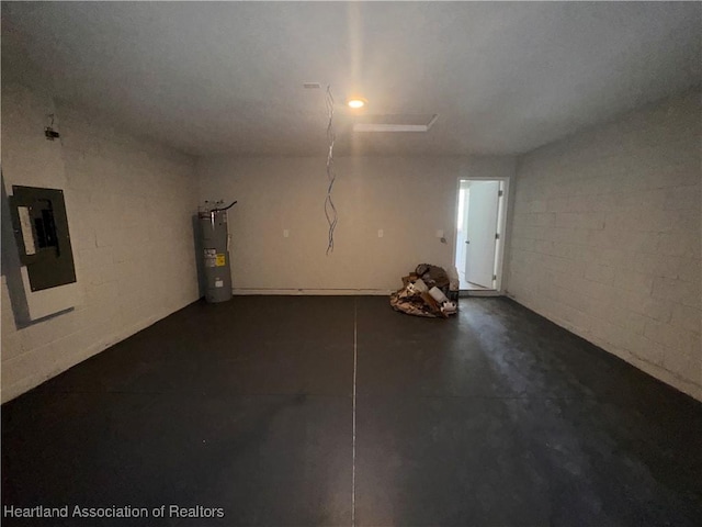 garage featuring electric water heater and electric panel