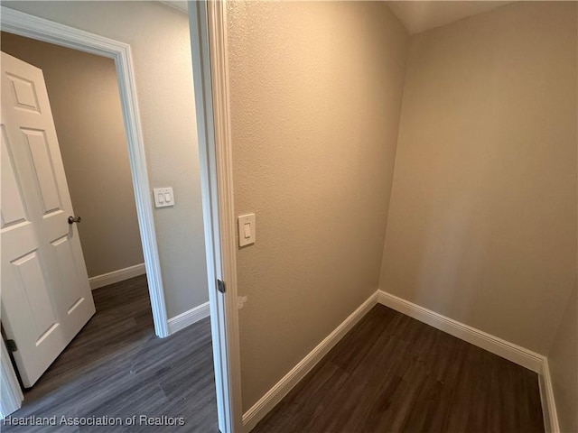 hall with dark hardwood / wood-style floors