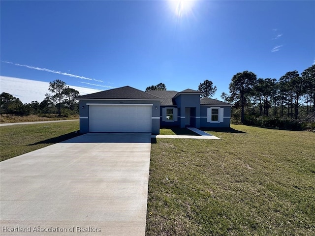 view of front facade with a garage and a front lawn