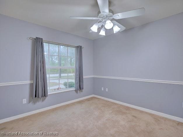 unfurnished room featuring ceiling fan, baseboards, and carpet floors