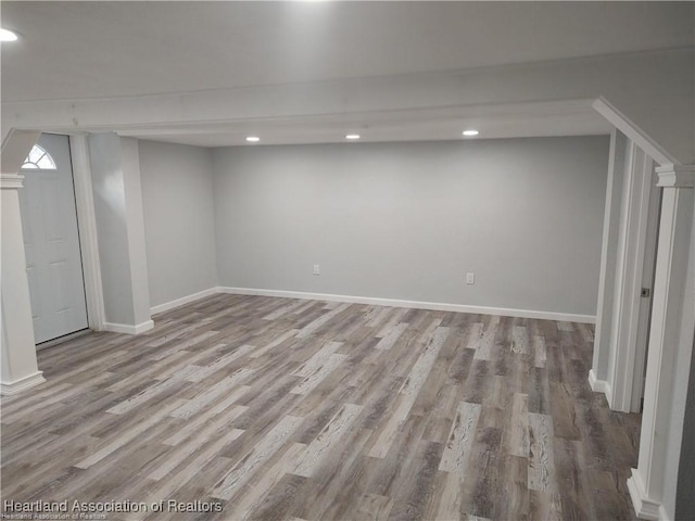 basement with light hardwood / wood-style floors