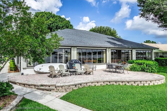 130 Deanna Dr, Lake Placid, FL 33852 - rear view of property featuring a patio, a shingled roof, and a yard